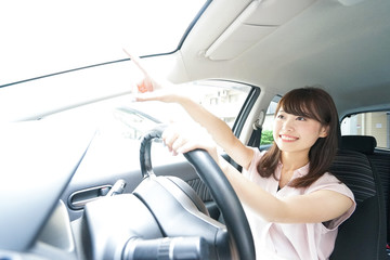 Young woman driving a car
