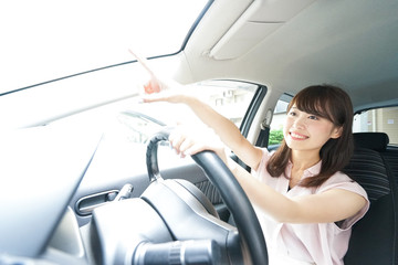 Young woman driving a car