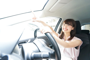 Young woman driving a car