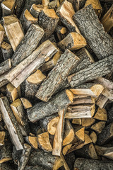 Big pile of firewood piled up randomly.