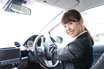 Businesswoman driving a car