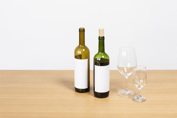 Fototapeta na wymiar wine bottle and glasses on the wood table isolated on the white background