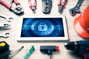 Web security and technology concept with tablet pc on wooden tab © adam121