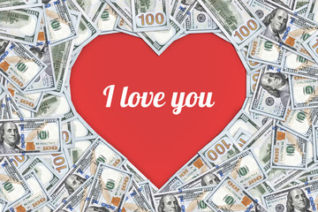 Heart shaped sign made with many 100 dollar banknotes isolated on white