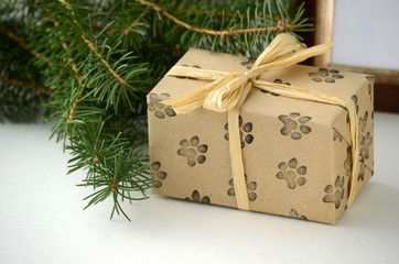Fototapeta na wymiar Beautifully wrapped Christmas present - holiday celebrations and gift giving. 