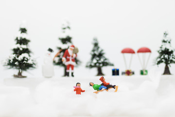 Miniature Santa Claus and Snow man make happy hour for children on Christmas day