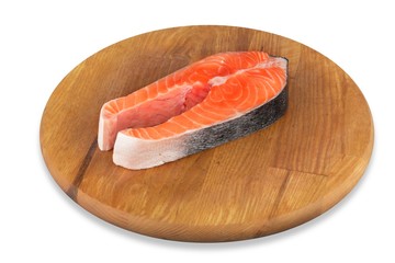 Fresh salmon fish on wooden cooking desk