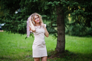 Portrait of blonde curly future bride at hen party.