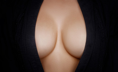 Topless beauty woman body covering her big breast