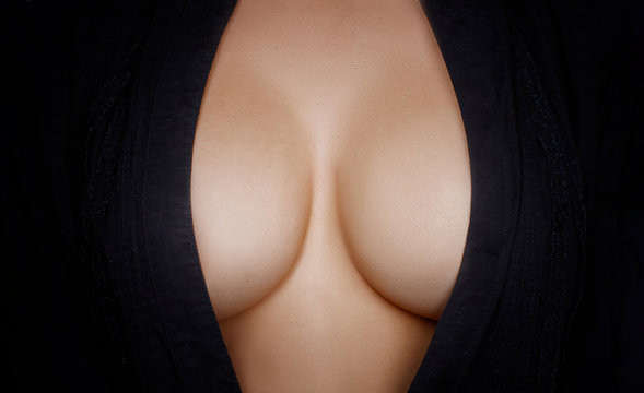 Topless beauty woman body covering her big breast