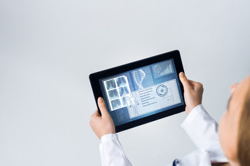 Close of female doctor hands working with tablet pc computer