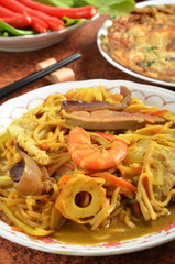 Curry-fried noodles with seafood on the plate