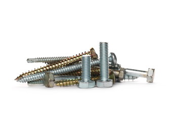 Pile metal nails, screws, bolts and nuts isolated on white background