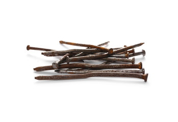 Pile of old, rusty metal nails isolated on white background