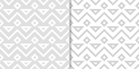 Light gray geometric ornaments. Set of seamless patterns