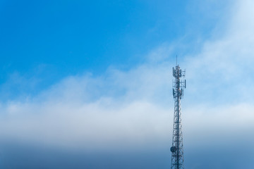 Telecommunications equipment, Cell Phone Antenna Tower, Wireless communication, Mobile phone tower, with mist in morning sky.