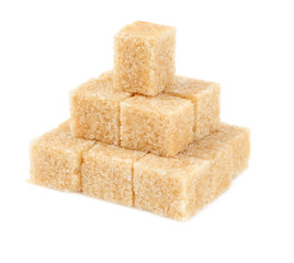 Cane sugar cubes isolated on white