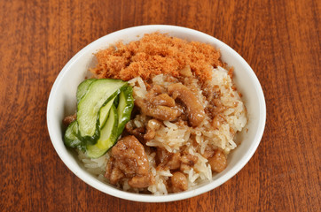 Braised pork rice on wood table