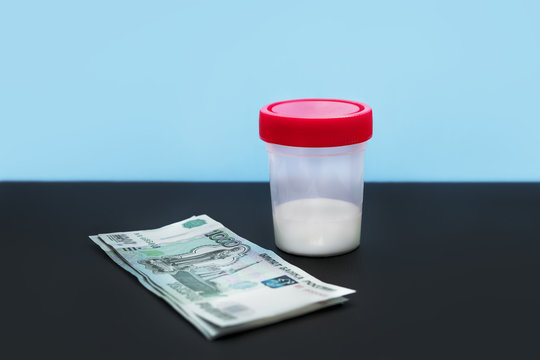 A plastic container with a small amount of sperm