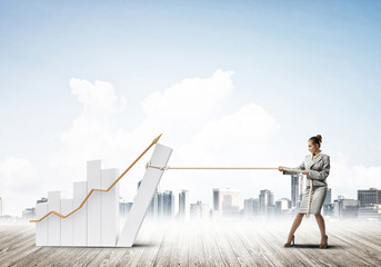 Obraz premium Businesswoman pulling graph with rope as concept of power and control