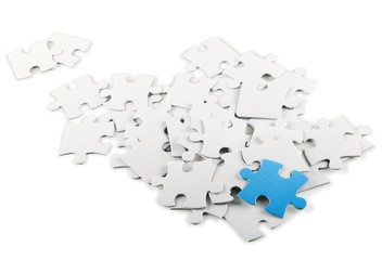 White Puzzle Pieces with One Blue Piece