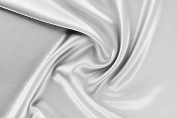 Obraz premium The texture of the satin fabric of white color for the background
