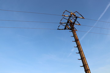 The old electric tower with beautiful blue sky