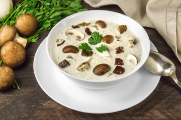 Mushroom soup with champignons, cremini, and parsley closeup
