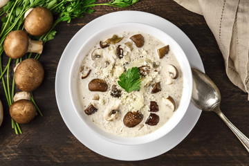 Plate of mushroom soup with champignons, cremini, and parsley