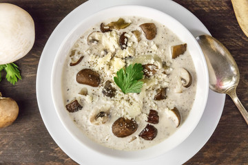 Closeup of mushroom soup with champignons, cremini, and parsley