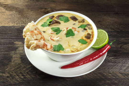 Tom Yam, traditional Thai soup with shrimps and mushrooms, with chilli pepper and lime