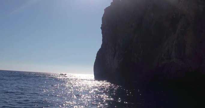 SARDINIA, ITALY  &ndash; JULY 2016 : Video shot of cliffs on Porto Flava beach on a sunny day with sea and boat in view