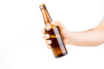 Hand Holding Beer Bottle On White Background Closeup