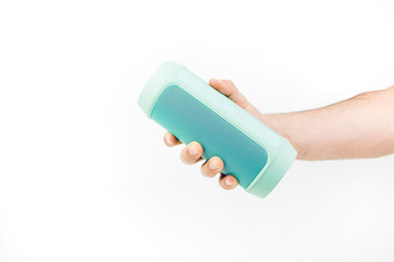 Hand Holding Blue Wireless Speaker On White Background