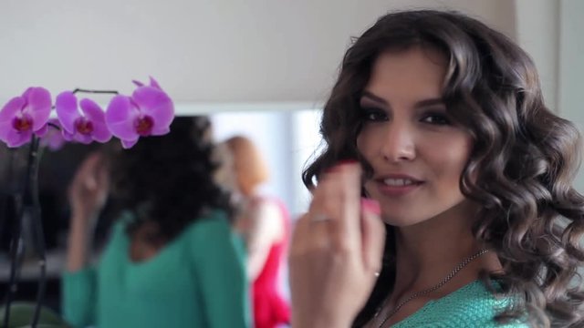 Beautiful sexy model shows hairstyle and mea good mood