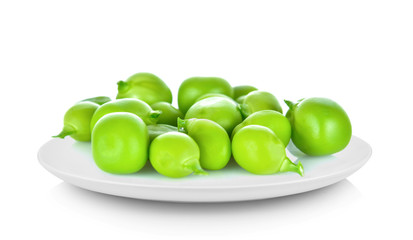 Snow peas seeds in white plate on white background