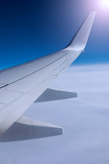 Fototapeta premium Beautiful view from window of airplane in sunrise sky 
