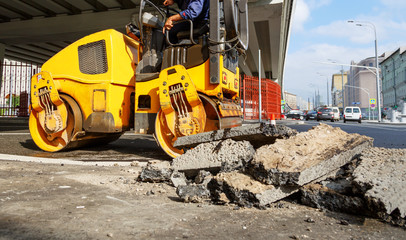 Asphalt compactor in the city