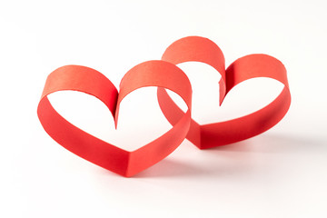 Two hearts made of ribbon on white background. Valentines day.