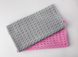 Clean kitchen towels on white background