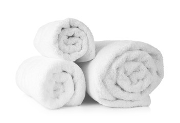 Fototapeta na wymiar Rolled terry towels on white background