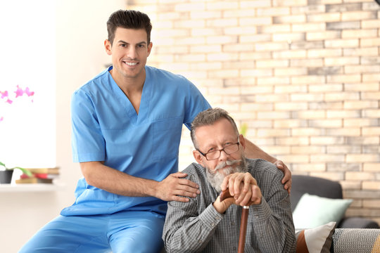 Caregiver with senior man at home