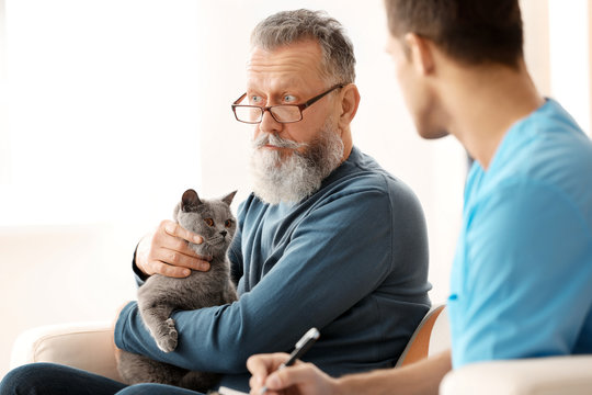Caregiver with senior man at home