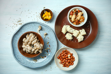 Set of dishware with ingredients on table