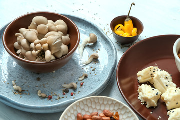 Set of dishware with ingredients on table