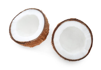 Halves of coconut on white background