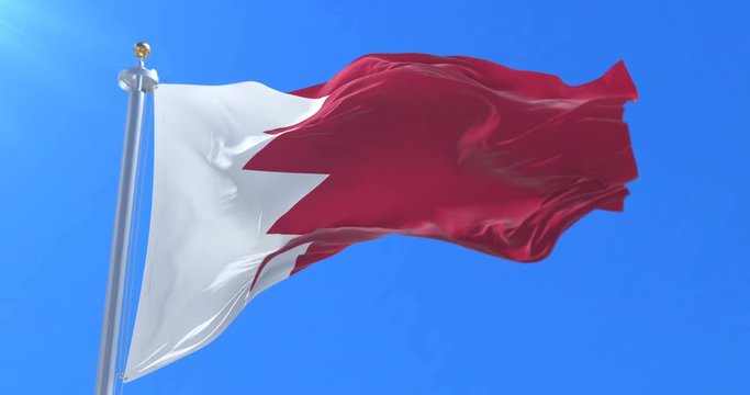 Bahrain flag waving at wind in slow with blue sky, loop