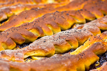 baked homemade rustic pie with apples, poppy seeds and jam
