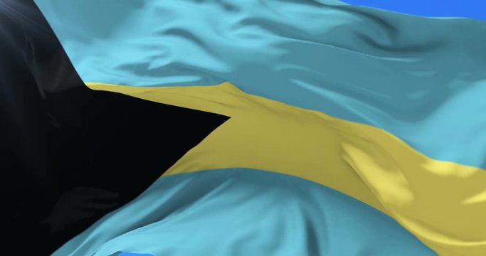 Bahamian flag waving at wind in slow with blue sky, loop