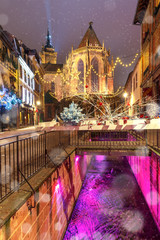 Saint Martin Church in old town of Colmar, decorated and illuminated at snowny christmas time,...